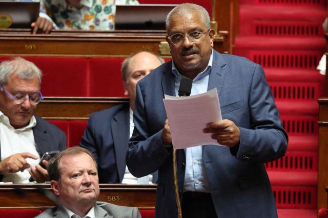 Gauche Democrate et Republicaine's MP Marcellin Nadeau (C) speaks during a session to debate a proposed bill aimed at abolishing the slavery-related laws at The National Assembly, France's lower house parliament, in Paris on May 28, 2026. These laws, known as Code Noir ("Black Code") classified enslaved people as "chattels" that could be acquired by a master in the same way as property, or established penalties for escapeincluding the cutting off of ears, branding with a lily, and even the death penalty. (Photo by Ludovic MARIN / AFP)