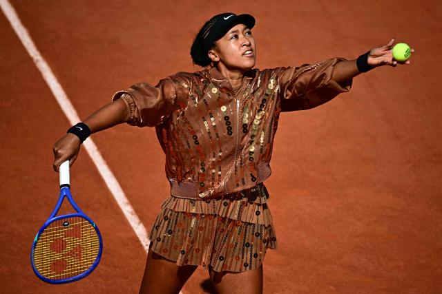 Japan's Naomi Osaka serves as she warms up prior to her women's singles match against Croatia's Donna Vekic on day 5 of the French Open tennis tournament on Court Simonne-Mathieu at the Roland-Garros Complex in Paris on May 28, 2026. (Photo by JULIEN DE ROSA / AFP)