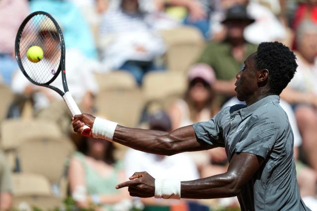 France's Moise Kouame plays a forehand return to Paraguay's Adolfo Daniel Vallejo during their men's singles match on day 5 of the French Open tennis tournament on Court Suzanne-Lenglen at the Roland-Garros Complex in Paris on May 28, 2026. (Photo by Dimitar DILKOFF / AFP)