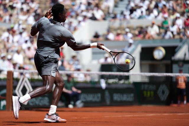 France's Moise Kouame plays a forehand return to Paraguay's Adolfo Daniel Vallejo during their men's singles match on day 5 of the French Open tennis tournament on Court Suzanne-Lenglen at the Roland-Garros Complex in Paris on May 28, 2026. (Photo by Dimitar DILKOFF / AFP)