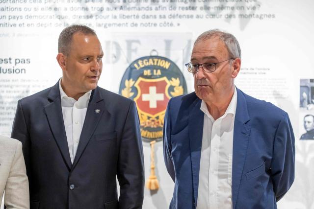 Poland's President Karol Nawrocki (L) and Switzerland's President Guy Parmelin (R) listen explanations during a guided tour of the Paderewski Museum collection and an exhibition on interned Polish soldiers during World War II in Morges on May 28, 2026. Nawrocki is on two-day state visit in Switzerland. (Photo by MARTIAL TREZZINI / POOL / AFP)