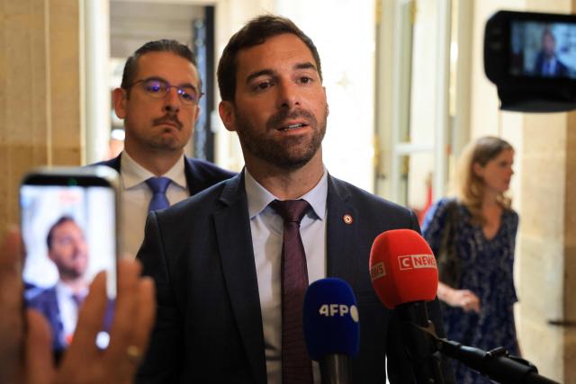 Rassemblement National's MP Julien Odoul speaks to journalists after a proposed bill aimed at abolishing the slavery-related laws passed unanimously at The National Assembly, France's lower house parliament, in Paris on May 28, 2026. These laws, known as Code Noir ("Black Code") classified enslaved people as "chattels" that could be acquired by a master in the same way as property, or established penalties for escapeincluding the cutting off of ears, branding with a lily, and even the death penalty. (Photo by Ludovic MARIN / AFP)