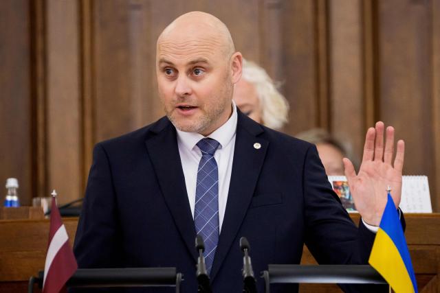 Andris Kulbergs, candidate for Prime Minister, speaks during a parliamentary session before voting for the approval of the new cabinet of government ministers in the Saeima (Parliament of Latvia) on May 28, 2026 in Riga, Latvia. (Photo by Gints Ivuskans and AFP / AFP)