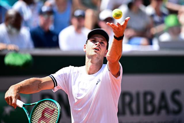 Poland's Hubert Hurkacz serves to US Frances Tiafoe during their men's singles match on day 5 of the French Open tennis tournament at the Roland-Garros Complex in Paris on May 28, 2026. (Photo by JULIEN DE ROSA / AFP)