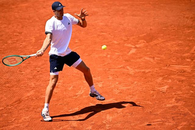 Poland's Hubert Hurkacz plays a forehand return to US Frances Tiafoe during their men's singles match on day 5 of the French Open tennis tournament at the Roland-Garros Complex in Paris on May 28, 2026. (Photo by JULIEN DE ROSA / AFP)