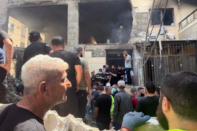 Rescue workers enter a building following an Israeli air strike in the Choueifat area, south of Beirut on the outskirts of the capitals southern suburbs, on May 28, 2026. A Lebanese military source told AFP that an Israeli strike hit an apartment south of Beirut on May 28, shortly after Israel's military said it launched a strike on the capital. The Israeli military said it launched an airstrike on the Lebanese capital Beirut after earlier strikes on the country's south killed at least 12 people, including two children, and wounded 21 others. (Photo by Ibrahim AMRO / AFP)