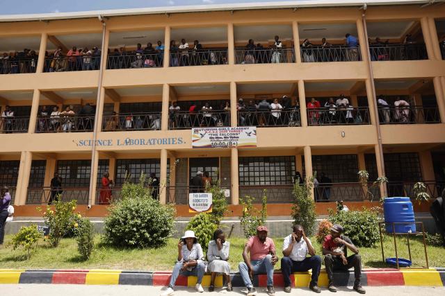 Relatives gather and wait for news of their loved ones at the Utumishi Girls Academy following the deadly fire in Gilgil, north of the capital Nairobi on May 28, 2026. A fire in a girls' dormitory in Kenya on May 28 killed 16 children and hospitalised 79 in the latest deadly blaze to hit a school in the east African country. The fire broke out shortly before 1:00 am local time at Utumishi Girls Academy in Nakuru County, around 120 kilometres (75 miles) north of the capital Nairobi, officials said. (Photo by SIMON MAINA / AFP)