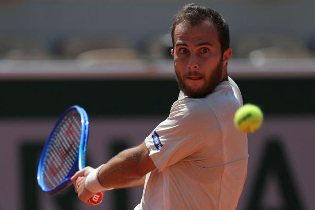 France's Hugo Gaston plays a backhand return to Argentina's Francisco Cerundolo during their men's singles match on day 5 of the French Open tennis tournament on Court Simonne-Mathieu at the Roland-Garros Complex in Paris on May 28, 2026. (Photo by Thomas SAMSON / AFP)