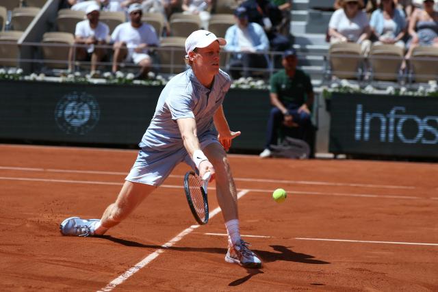 Italy's Jannik Sinner volleys a return to Argentina's Juan Manuel Cerundolo during their men's singles match on day 5 of the French Open tennis tournament on Court Philippe-Chatrier at the Roland-Garros Complex in Paris on May 28, 2026. (Photo by Alain JOCARD / AFP)