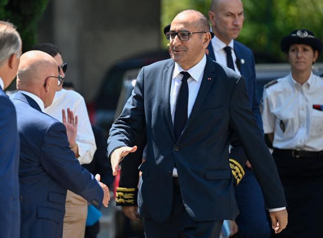 France's Interior Minister Laurent Nunez shakes hands as he arrives in the Les Moulins neighbourhood in Nice, south-eastern France on May 28, 2026. (Photo by Frederic Dides / AFP)