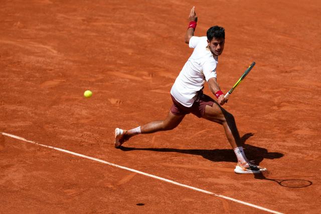 Paraguay's Adolfo Daniel Vallejo plays a backhand return to France's Moise Kouame during their men's singles match on day 5 of the French Open tennis tournament on Court Suzanne-Lenglen at the Roland-Garros Complex in Paris on May 28, 2026. (Photo by Dimitar DILKOFF / AFP)