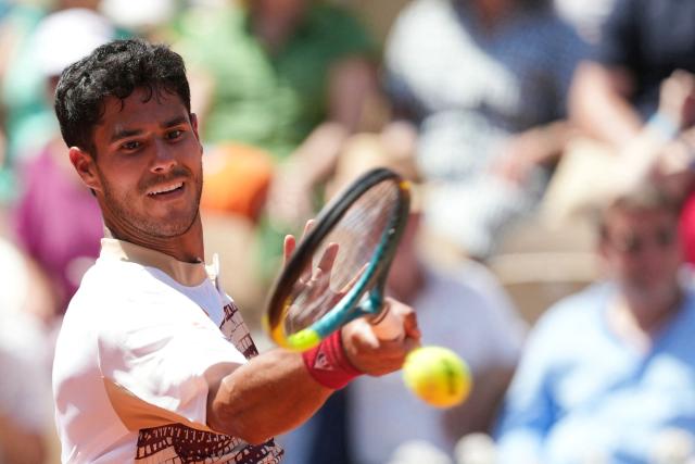 Paraguay's Adolfo Daniel Vallejo plays a forehand return to France's Moise Kouame during their men's singles match on day 5 of the French Open tennis tournament on Court Suzanne-Lenglen at the Roland-Garros Complex in Paris on May 28, 2026. (Photo by Dimitar DILKOFF / AFP)