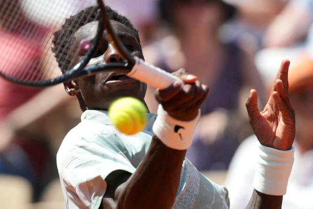 France's Moise Kouame plays a forehand return to Paraguay's Adolfo Daniel Vallejo during their men's singles match on day 5 of the French Open tennis tournament on Court Suzanne-Lenglen at the Roland-Garros Complex in Paris on May 28, 2026. (Photo by Dimitar DILKOFF / AFP)