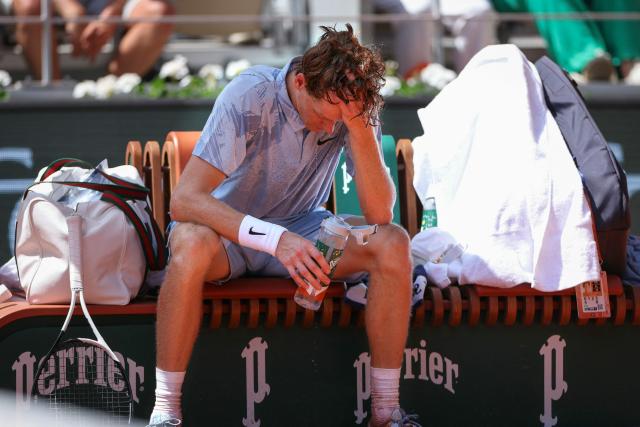 Italy's Jannik Sinner tries to cool down during a break of play in his men's singles match against Argentina's Juan Manuel Cerundolo on day 5 of the French Open tennis tournament on Court Philippe-Chatrier at the Roland-Garros Complex in Paris on May 28, 2026. (Photo by ALAIN JOCARD / AFP)