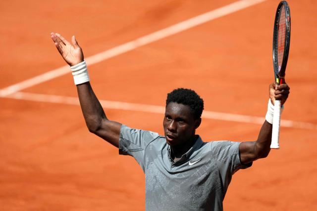 France's Moise Kouame reacts after winning a game as he plays against Paraguay's Adolfo Daniel Vallejo during their men's singles match on day 5 of the French Open tennis tournament on Court Suzanne-Lenglen at the Roland-Garros Complex in Paris on May 28, 2026. (Photo by Dimitar DILKOFF / AFP)