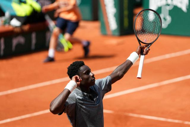 France's Moise Kouame reacts after winning a game as he plays against Paraguay's Adolfo Daniel Vallejo during their men's singles match on day 5 of the French Open tennis tournament on Court Suzanne-Lenglen at the Roland-Garros Complex in Paris on May 28, 2026. (Photo by Dimitar DILKOFF / AFP)