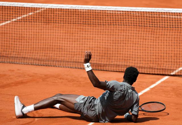 France's Moise Kouame falls on the court as he plays against Paraguay's Adolfo Daniel Vallejo during their men's singles match on day 5 of the French Open tennis tournament on Court Suzanne-Lenglen at the Roland-Garros Complex in Paris on May 28, 2026. (Photo by Dimitar DILKOFF / AFP)