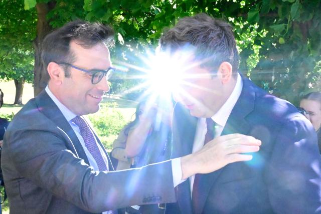 Lars Klingbeil, German Finance Minister and Vice Chancellor (R) and Spain's Finance Minister Carlos Cuerpo react while lit by sunlight during a meeting with the Finance Ministers of France, Italy, the Netherlands and Poland at the Recreation Center of the German central bank (Deutsche Bundesbank) in Berlin on May 28, 2026. (Photo by Tobias SCHWARZ / AFP)