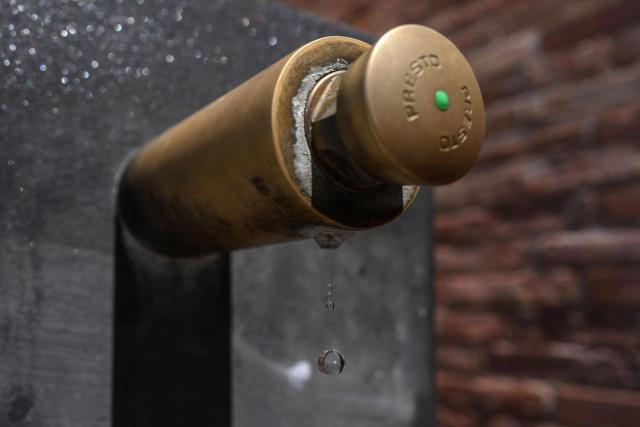 This photograph shows a water drips from a public water fountain in Toulouse, southwestern France, on May 28, 2026 as a heatwave hits France. Western Europe faced another day of record-breaking temperatures as a heatwave pushed the mercury well above normal levels for May. A so-called "heat dome" of warm air from northern Africa trapped under a high-pressure system over western Europe is behind the sort of heat not usually seen until high summer. (Photo by Ed JONES / AFP)