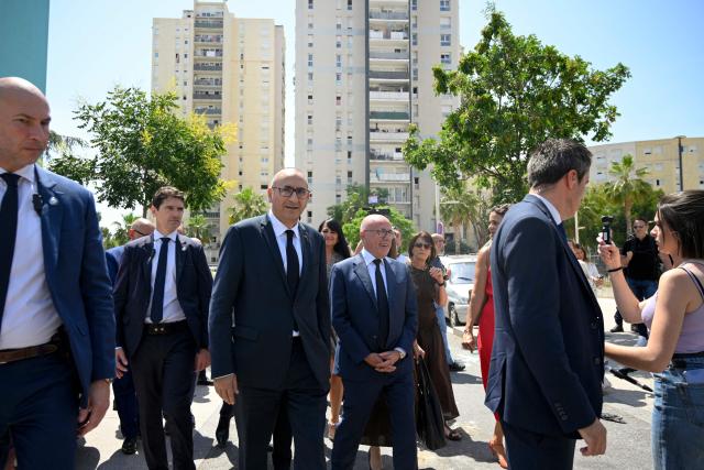 France's Interior Minister Laurent Nunez (3rdL) and Mayor of Nice Eric Ciotti (C) visit the Les Moulins neighbourhood in Nice, south-eastern France on May 28, 2026. (Photo by Frederic DIDES / AFP)