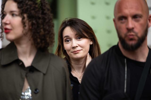 (FILES) Xenia Fedorova (C), the former director of the French version of Russian state-run foreign language channel RT which was banned in France after the Russian invasion of Ukraine, reacts as activists of the organization "For Ukraine, for their freedom and ours" stage a protest against her presence to promote her book entitled "Bannie" ("Banned"), at the stand of French publishing house Fayard during the "Festival du Livre de Paris 2025" book fair at the Grand Palais venue in Paris on April 12, 2025. Former director of the French version of Russian state-run foreign language channel RT and commentator in media outlets belonging to the Bollore galaxy, including CNews, Xenia Fedorova is accused, even within the French government, of promoting Kremlin propaganda there. (Photo by Xavier GALIANA / AFP)