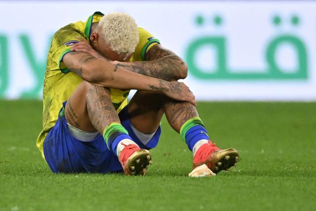 (FILES) Brazil's forward #10 Neymar reacts after his team lost the Qatar 2022 World Cup quarter-final football match between Croatia and Brazil at Education City Stadium in Al-Rayyan, west of Doha, on December 9, 2022. Brazil forward Neymar is a doubt for the start of the World Cup after injuring his calf, requiring two to three weeks of treatment, the national team's doctor Rodrigo Lasmar said on May 28, 2026. (Photo by NELSON ALMEIDA / AFP)