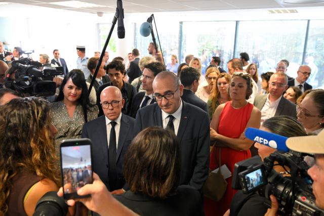 (from L) UDR's MP Christelle D'Intorni, mayor of Nice Eric Ciotti, France's Interior Minister Laurent Nunez and Deputy Prefect responsible for Urban Policy and Social Policy, Celine Maquet meet with representatives of local associations during a visit to the Les Moulins neighbourhood in Nice, south-eastern France on May 28, 2026. Two men and a woman suspected of being involved in a shooting that left two people dead and six injured in Nice on May 11 in the Les Moulins district of Nice have been charged and remanded in custody, in a new case illustrating the turf wars associated with drug-related gang activity. (Photo by Frederic DIDES / AFP)