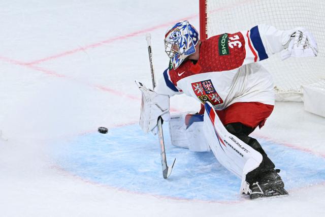 Czech Republic's goalkeeper #32 Josef Korenar dives to block a shot during the IIHF Ice Hockey Men's World Championship quarter-final match between Finland and Czech Republic at the Swiss Life Arena in Zurich, Switzerland on May 28, 2026. (Photo by SEBASTIEN BOZON / AFP)