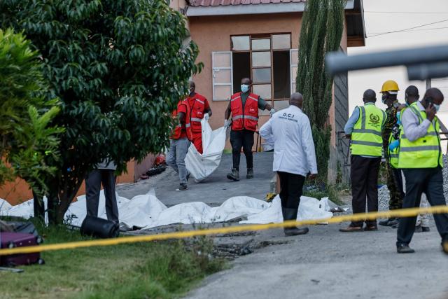 Kenya Red Cross workers retrieve one of the bodies at the Utumishi Girls Academy following the deadly fire in Gilgil, north of the capital Nairobi on May 28, 2026. A fire in a girls' dormitory in Kenya on May 28 killed 16 children and hospitalised 79 in the latest deadly blaze to hit a school in the east African country. The fire broke out shortly before 1:00 am local time at Utumishi Girls Academy in Nakuru County, around 120 kilometres (75 miles) north of the capital Nairobi, officials said. (Photo by SIMON MAINA / AFP)