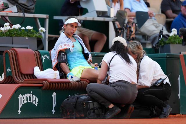Austria's Julia Grabher receives medical treatment as she plays against US Amanda Anisimova during their women's singles match on day 5 of the French Open tennis tournament on Court Suzanne-Lenglen at the Roland-Garros Complex in Paris on May 28, 2026. (Photo by Dimitar DILKOFF / AFP)
