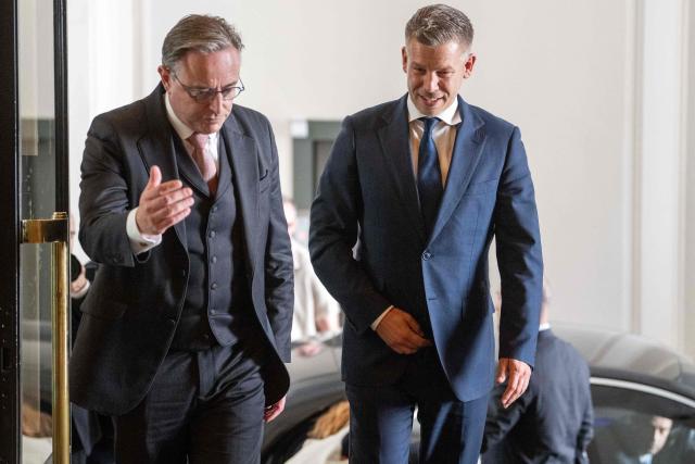 Belgium's Prime Minister Bart De Wever (L) welcomes Hungary's Prime Minister Peter Magyar prior to a meeting in Brussels on May 28, 2026. (Photo by JONAS ROOSENS / Belga / AFP) / Belgium OUT