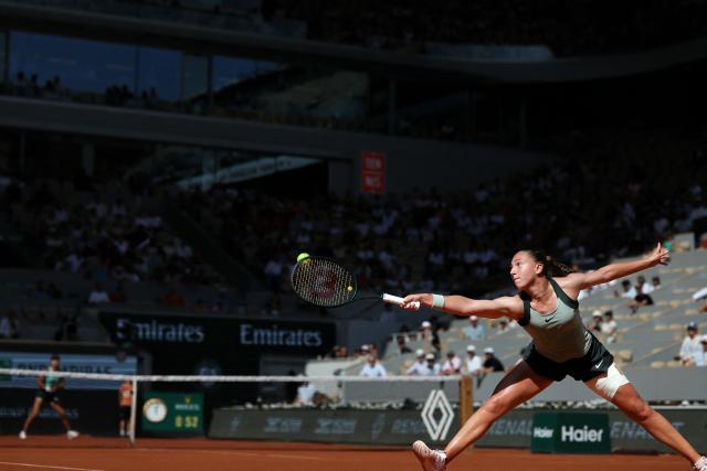 France's Diane Parry stretches to play a backhand return to US Ann Li during their women's singles match on day 5 of the French Open tennis tournament on Court Philippe-Chatrier at the Roland-Garros Complex in Paris on May 28, 2026. (Photo by ALAIN JOCARD / AFP)