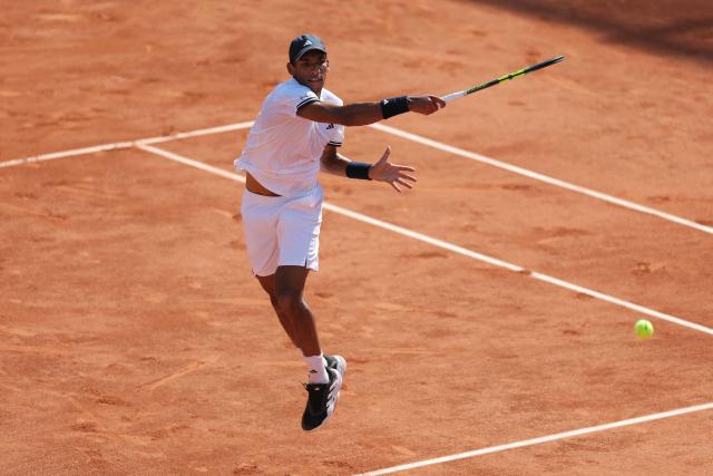 Canada's Felix Auger-Aliassime plays a forehand return to Argentina's Roman Andres Burruchaga during their men's singles match on day 5 of the French Open tennis tournament on Court Simonne-Mathieu at the Roland-Garros Complex in Paris on May 28, 2026. (Photo by Thomas SAMSON / AFP)