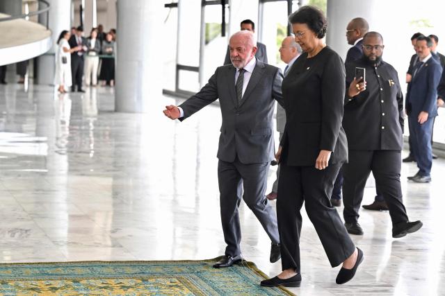 Suriname’s President Jennifer Geerlings-Simons (R) is welcomed by Brazil’s President Luiz Inacio Lula da Silva at Planalto Palace in Brasilia, on May 28, 2025. (Photo by Evaristo Sa / AFP)