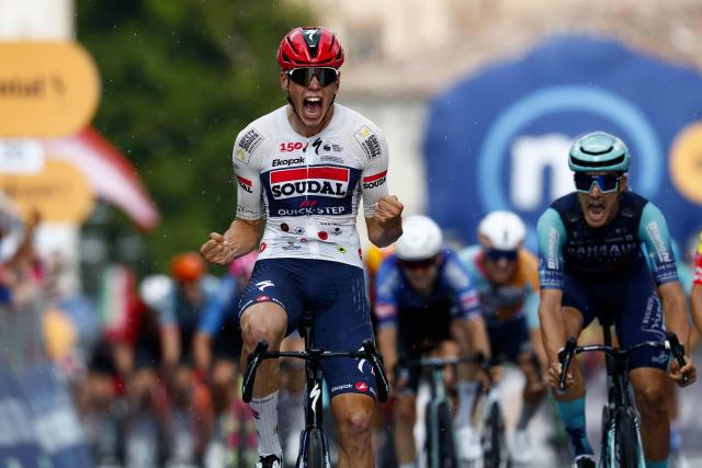 Soudal Quick-Step French rider Paul Magniercelebrates as he crosses the finish line to win the 18th stage of the Giro d'Italia 2026 - Tour of Italy cycling race between Fai della Paganella and Pieve di Soligo, Italy, on May 28, 2026. (Photo by Luca Bettini / AFP)