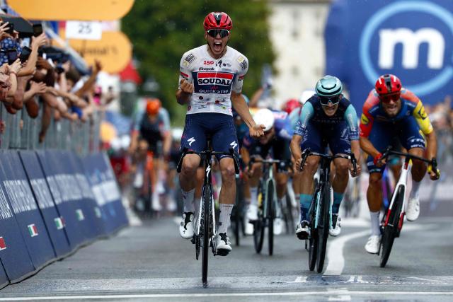 Soudal Quick-Step French rider Paul Magnier celebrates as he crosses the finish line to win the 18th stage of the Giro d'Italia 2026 - Tour of Italy cycling race between Fai della Paganella and Pieve di Soligo, Italy, on May 28, 2026. (Photo by Luca Bettini / AFP)