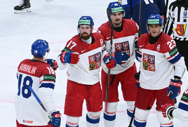 Czech Republic's defender #17 Filip Hronek celebrates with teammates after scoring his team's first goal during the IIHF Ice Hockey Men's World Championship quarter-final match between Finland and Czech Republic at the Swiss Life Arena in Zurich, Switzerland on May 28, 2026. (Photo by SEBASTIEN BOZON / AFP)