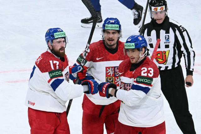 Czech Republic's defender #17 Filip Hronek celebrates with teammates after scoring his team's first goal during the IIHF Ice Hockey Men's World Championship quarter-final match between Finland and Czech Republic at the Swiss Life Arena in Zurich, Switzerland on May 28, 2026. (Photo by SEBASTIEN BOZON / AFP)