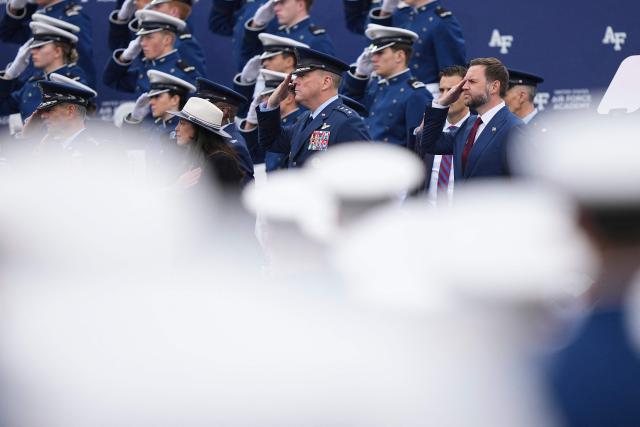 US Vice President JD Vance (R) salutes as graduating cadets arrive ahead of his commencement speech for the 2026 graduating class of the US Air Force Academy, in Colorado Springs, Colorado, on May 28, 2026. (Photo by Matt Rourke / POOL / AFP)