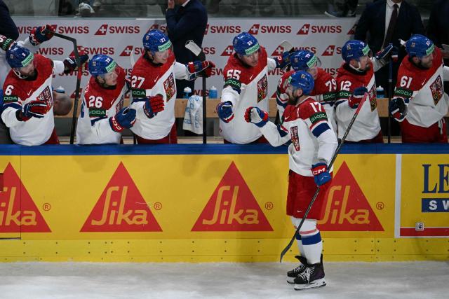Czech Republic's defender #17 Filip Hronek celebrates with teammates after scoring his team's first goal during the IIHF Ice Hockey Men's World Championship quarter-final match between Finland and Czech Republic at the Swiss Life Arena in Zurich, Switzerland on May 28, 2026. (Photo by SEBASTIEN BOZON / AFP)