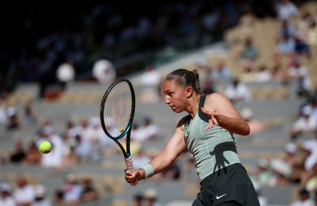 France's Diane Parry plays a backhand return to US Ann Li during their women's singles match on day 5 of the French Open tennis tournament on Court Philippe-Chatrier at the Roland-Garros Complex in Paris on May 28, 2026. (Photo by Alain JOCARD / AFP)