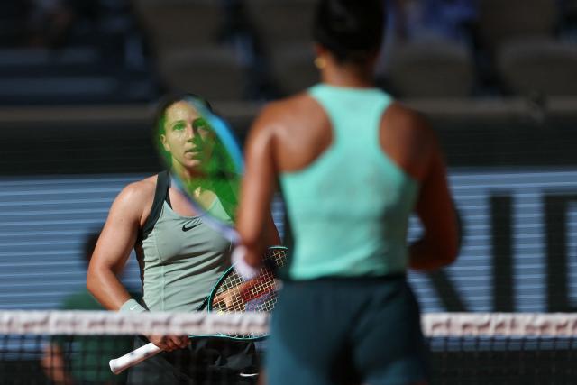 France's Diane Parry (L) reacts to her victory against US Ann Li (R) at the end of their women's singles match on day 5 of the French Open tennis tournament on Court Philippe-Chatrier at the Roland-Garros Complex in Paris on May 28, 2026. (Photo by Alain JOCARD / AFP)