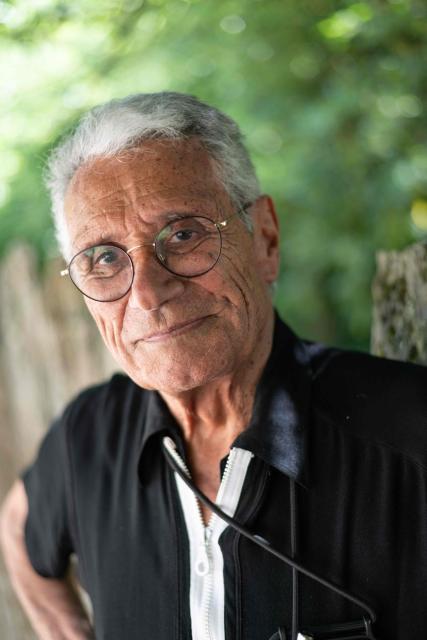 French photographer Jean-Marie Perier poses for photographs as he presents his exhibition "My pop years" during a press tour as part of the "La Gacilly" photo festival in La Gacilly, western France, on May 28, 2026. La Gacilly photo festival will runs to June 1 to October 2026. (Photo by Sebastien Salom-Gomis / AFP)