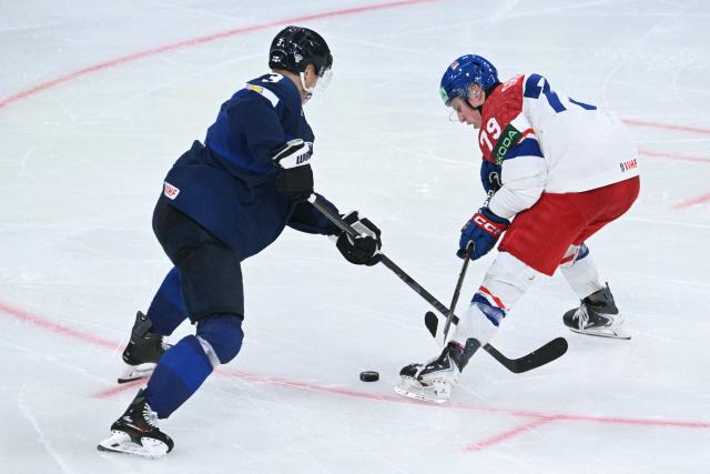 Czech Republic's defender #79 Tomas Galvas (R) vies for the puck during the IIHF Ice Hockey Men's World Championship quarter-final match between Finland and Czech Republic at the Swiss Life Arena in Zurich, Switzerland on May 28, 2026. (Photo by SEBASTIEN BOZON / AFP)