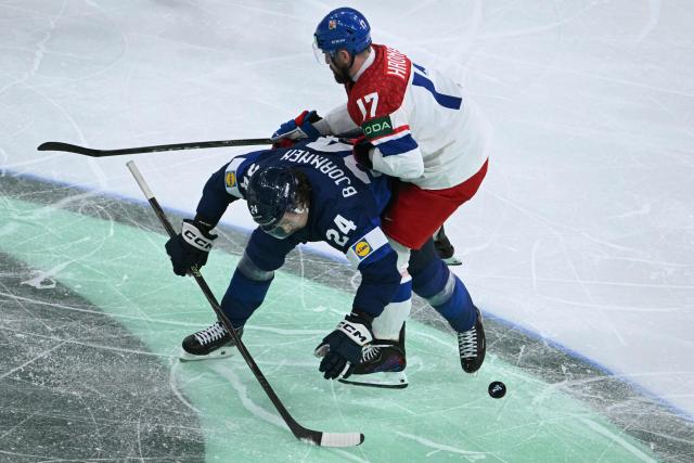 Finland's forward #24 Hannes Bjorninen and Czech Republic's defender #17 Filip Hronek vie for the puck during the IIHF Ice Hockey Men's World Championship quarter-final match between Finland and Czech Republic at the Swiss Life Arena in Zurich, Switzerland on May 28, 2026. (Photo by SEBASTIEN BOZON / AFP)