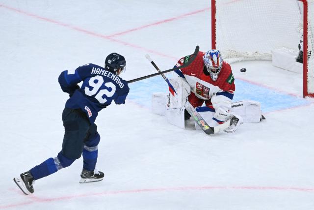 Finland's forward #92 Lenni Hameenaho scores his team's fourth goal past Czech Republic's goalkeeper #32 Josef Korenar during the IIHF Ice Hockey Men's World Championship quarter-final match between Finland and Czech Republic at the Swiss Life Arena in Zurich, Switzerland on May 28, 2026. (Photo by SEBASTIEN BOZON / AFP)