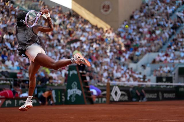 US Coco Gauff plays a backhand return to Egypt's Mayar Sherif during their women's singles match on day 5 of the French Open tennis tournament on Court Suzanne-Lenglen at the Roland-Garros Complex in Paris on May 28, 2026. (Photo by Dimitar DILKOFF / AFP)