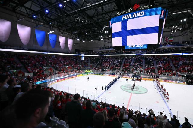 This general view shows the Swiss Life Arena and a screen displaying Finland's flag at the end of the IIHF Ice Hockey Men's World Championship quarter-final match between Finland and Czech Republic in Zurich, Switzerland on May 28, 2026. (Photo by SEBASTIEN BOZON / AFP)