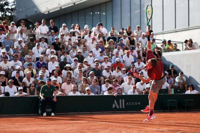 France's Luca Van Assche serves to US Brandon Nakashima during their men's singles match on day 5 of the French Open tennis tournament at the Roland-Garros Complex in Paris on May 28, 2026. (Photo by Anne-Christine POUJOULAT / AFP)