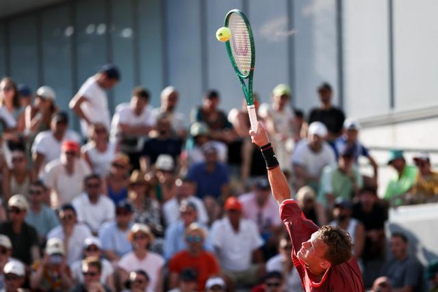 France's Luca Van Assche serves to US Brandon Nakashima during their men's singles match on day 5 of the French Open tennis tournament at the Roland-Garros Complex in Paris on May 28, 2026. (Photo by Anne-Christine POUJOULAT / AFP)